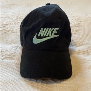 Nike ball cap; iridescent blue logo, black hat